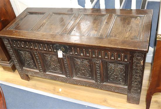 A 17th century panelled oak coffer W.127cm